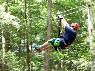 Photo of participant on canopy tour (Summit BSA photo)