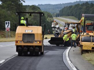 Photo of work crew resurfacing a roadway (Georgia DOT photo)