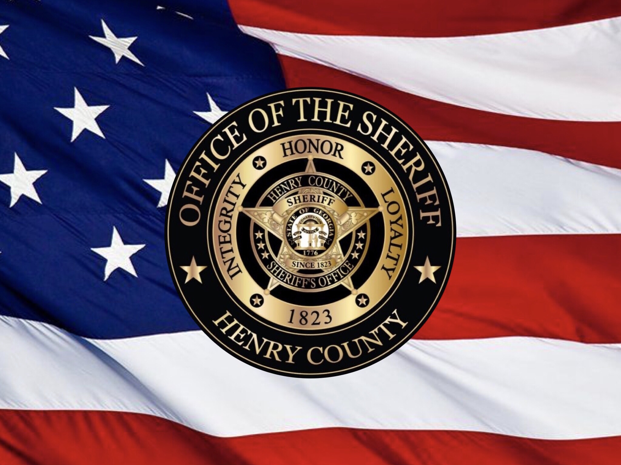 Photo of Henry County Sheriff’s Office logo on American flag background