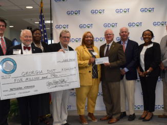 Photo of Henry County elected officials and staff presenting Georgia DOT with $5 million dollars for Bethlehem Road interchange (Henry County photo)