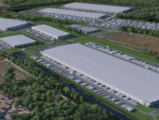 Photo shows several large industrial buildings with truck parking around them. Photo shows concept for Gardner Logistics Park in Locust Grove (Scannell Properties photo).