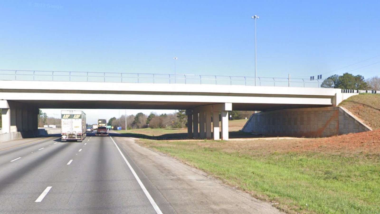 Photo of I-75 North at Jodeco Road. Photo shows the bridge structure and extra space for future collector-distributor lanes (Google Streetview photo).