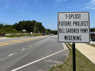 Photo of Bill Gardner Parkway near SR 155 and T-SPLOST future project road sign (Clayton Carte photo).