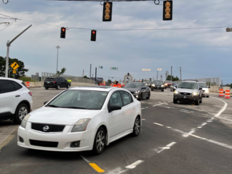 Photo shows motorists using the new diverging diamond interchange at I-75 exit 218 / state route 20 on Monday morning, June 27 (Clayton Carte photo).