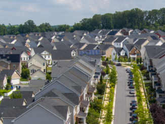 Photo showing a subdivision with rows of homes (stock photo).