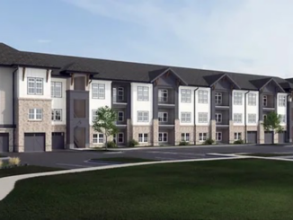 Photo shows three-story architectural rendering for Arcadia at Symphony Park development in McDonough. Building has a brick exterior on the ground floor with alternating black and white color scheme on upper floors (Third Lake Development / Geheber Lewis Associates photo).