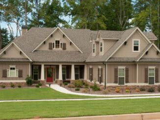 Photo showing a one-story ranch home with craftsman style siding and side-entry garage (Moore Bass Consulting photo).