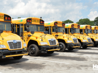 Photo showing a group of school buses (Henry County Schools photo).