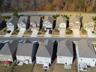 Photo shows a row of homes built closely together (stock photo).