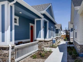 Photo shows detached homes separated by a walkway (Avilla Homes photo).