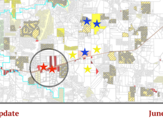 Photo shows a map of Ola with stars to represent new and proposed developments (Henry County base map / Clayton Carte graphic).