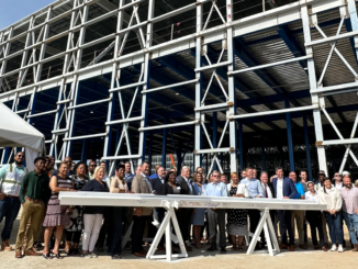 Photo shows group of people at NewCold Topping Out Event in July 2023 (Clayton Carte photo).