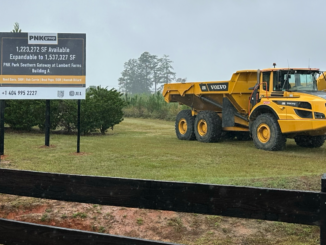 Photo shows construction equipment and leasing sign at Lambert Farms Building A (Clayton Carte photo).