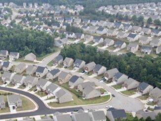 Aerial photo shows several subdivisions with homes on small lots (special photo).