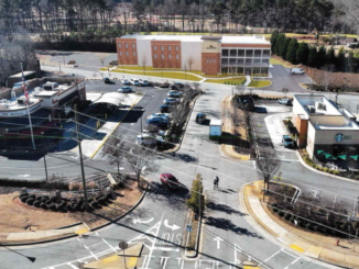 Photo shows concept rendering for the Lake Dow Self-Storage Business, being proposed behind the Chick-fil-A and Starbucks (Barnes Gibson Partners Architects photo).
