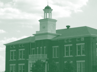 Photo shows the Locust Grove city hall building (Clayton Carte photo).