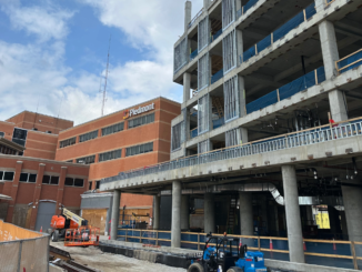 Photo shows Piedmont Henry Hospital and the under-construction east tower as of February 2025 (Clayton Carte photo).
