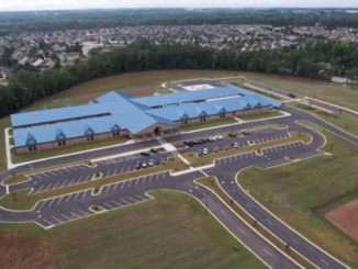 Aerial photo shows Birch Creek Elementary School and the adjacent subdivisions in the background (Andrews, Hammock, & Powell, Inc. photo from Youtube).