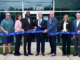 Photo shows Delta Community Credit Union staff, Henry County Chamber of Commerce and Locust Grove officials at the Delta Community Credit Union ribbon cutting on Monday, May 19, 2025 (Delta Community Credit Union photo).