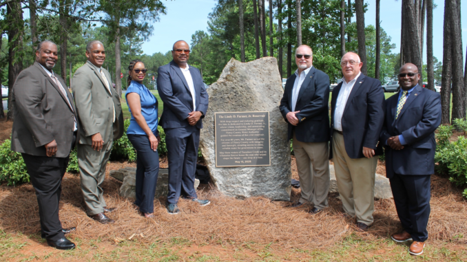 HCWA Lindy Farmer Reservoir Dedication Image shows the Henry County Water Authority board, General Manager Tony Carnell and former General Manager Lindy Farmer at the Farmer Reservoir dedication in May 2025 (HCWA photo).