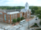 Photo shows a Henry County Transit bus in front of the Henry County Courthouse (Henry County photo).