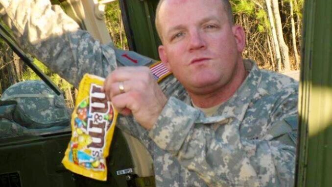 SFC John Beale Sgt. 1st Class John Beale, then Staff Sgt., poses with his favorite candy while seating in a Georgia Army National Guard armored humvee. Beale joined the GAARNG in 2004 as a calvary scout after previously serving on active duty from 1989 to 1995.