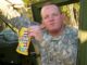 Sgt. 1st Class John Beale, then Staff Sgt., poses with his favorite candy while seating in a Georgia Army National Guard armored humvee. Beale joined the GAARNG in 2004 as a calvary scout after previously serving on active duty from 1989 to 1995.